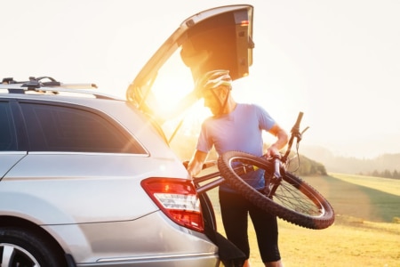 Cyclist loading boot to transport bike in car