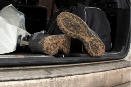 Muddy boots in car.